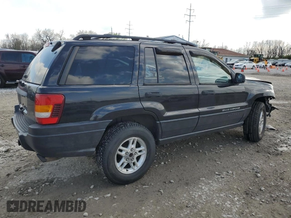 2004 Jeep Grand Cherokee Laredo with VIN 1J4GW48S84C184757, listed as a Copart auction lot 52895745 with 242,307 mi miles and Salvage Title. Bid and sale history available at carsss.com. Image 3.