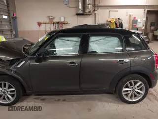 2012 MINI Countryman S with VIN WMWZC3C59CWL83491, listed as a IAAI auction lot 41791573 with 115,355 mi miles and . Bid and sale history available at DreamBid. Image 15.