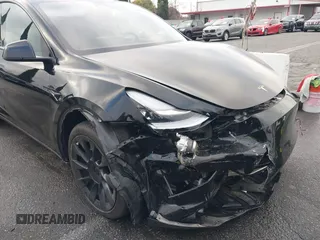 2023 Tesla Model Y Long Range with VIN 7SAYGDEE2PA024032, listed as a IAAI auction lot 41213403 with 23,418 mi miles and . Bid and sale history available at DreamBid. Image 6.