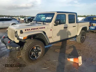2022 Jeep Gladiator Rubicon с VIN 1C6JJTBG3NL174980, выставлен на аукционе Copart как лот 85774884 с пробегом Не указан миль и На запчасти • Non repairable. История ставок и продаж доступна на DreamBid. Изображение 1.