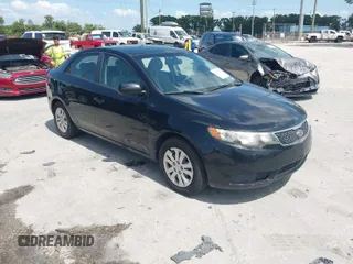 2012 Kia Forte LX with VIN KNAFT4A29C5609052, listed as a IAAI auction lot 42005977 with 128,798 mi miles. Bid and sale history available at carsss.com. Image 1.