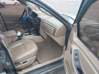 2002 Jeep Grand Cherokee Laredo with VIN 1J4GW48NX2C151430, listed as a IAAI auction lot 41886769 with 222,795 mi miles. Bid and sale history available at carsss.com. Image 5.