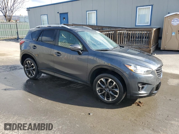2016 Mazda CX-5 Grand Touring with VIN JM3KE4DY0G0679190, listed as a Copart auction lot 53619495 with 154,649 mi miles and Salvage Title. Bid and sale history available at carsss.com. Image 4.