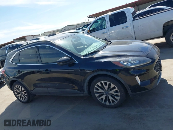 2020 Ford Escape Titanium Hybrid with VIN 1FMCU0DZ9LUC08090, listed as a IAAI auction lot 41674697 with 43,586 mi miles and . Bid and sale history available at DreamBid. Image 13.