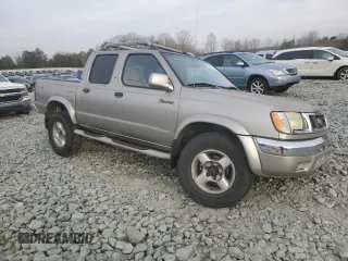 2000 Nissan Frontier XE with VIN 1N6ED27Y3YC366060, listed as a Copart auction lot 48955585 with 158,565 mi miles and Salvage title. Bid and sale history available at DreamBid. Image 4.