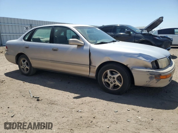 1997 Toyota Avalon XL with VIN 4T1BF12B0VU187179, listed as a Copart auction lot 54708565 with 336,922 mi miles and Salvage Title. Bid and sale history available at DreamBid. Image 4.