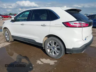 2020 Ford Edge Titanium z VIN 2FMPK3K98LBA42159, wystawiony jako IAAI lot #42358229 z przebiegiem 88 512 mil mil oraz . Historia ofert i sprzedaży dostępna na DreamBid. Obrazek 3.