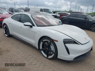 2022 Porsche Taycan z VIN WP0AA2Y10NSA12920, wystawiony jako IAAI lot #42047850 z przebiegiem 22 300 mil mil oraz . Historia ofert i sprzedaży dostępna na DreamBid. Obrazek 1.