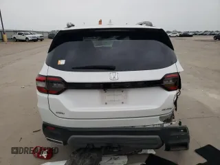 2023 Honda Pilot Elite z VIN 5FNYG1H81PB045653, wystawiony jako Copart lot #51252065 z przebiegiem 57 388 mil mil oraz Szkoda całkowita • Salvage title. Historia ofert i sprzedaży dostępna na DreamBid. Obrazek 6.