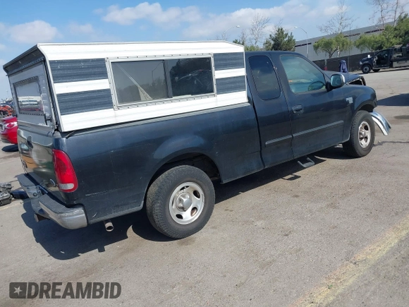 2002 Ford F-150 XL with VIN 1FTRX17L02NB79722, listed as a IAAI auction lot 41538404 with 202,050 mi miles. Bid and sale history available at carsss.com. Image 4.