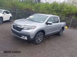 2020 Honda Ridgeline RTL-E with VIN 5FPYK3F73LB004365, listed as a IAAI auction lot 41965887 with 80,981 mi miles and . Bid and sale history available at DreamBid. Image 2.
