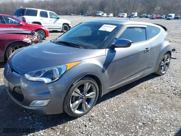 2016 Hyundai Veloster with VIN KMHTC6AD9GU264048, listed as a IAAI auction lot 41634443 with 103,758 mi miles. Bid and sale history available at carsss.com. Image 2.