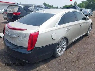 2014 Cadillac XTS Luxury z VIN 2G61M5S38E9291182, wystawiony jako IAAI lot #42495838 z przebiegiem 104 941 mil mil oraz . Historia ofert i sprzedaży dostępna na DreamBid. Obrazek 4.