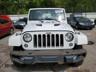 2016 Jeep Wrangler Unlimited Sahara z VIN 1C4HJWEGXGL198684, wystawiony jako Copart lot #49936525 z przebiegiem 158 396 mil mil oraz Szkoda całkowita • Salvage title. Historia ofert i sprzedaży dostępna na DreamBid. Obrazek 5.
