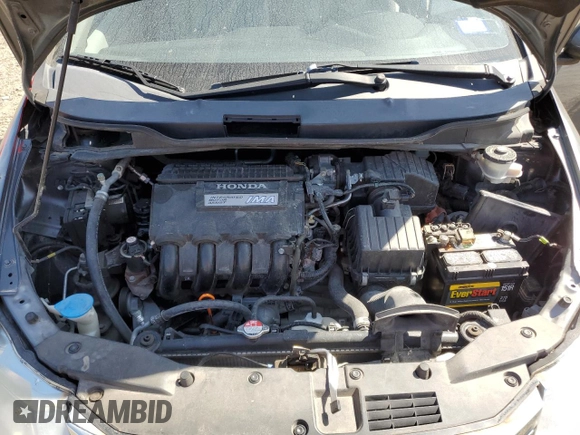 2012 Honda Insight z VIN JHMZE2H34CS003929, wystawiony jako Copart lot #52707885 z przebiegiem 131 596 mil mil oraz Szkoda całkowita • Salvage title. Historia ofert i sprzedaży dostępna na DreamBid. Obrazek 11.