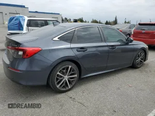 2022 Honda Civic Touring z VIN 2HGFE1F93NH314236, wystawiony jako Copart lot #53380915 z przebiegiem 25 302 mil mil oraz Szkoda całkowita • Salvage title. Historia ofert i sprzedaży dostępna na DreamBid. Obrazek 3.