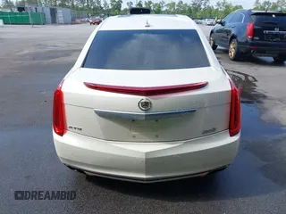 2013 Cadillac XTS Premium z VIN 2G61S5S35D9103948, wystawiony jako IAAI lot #42090444 z przebiegiem 154 728 mil mil oraz . Historia ofert i sprzedaży dostępna na DreamBid. Obrazek 16.