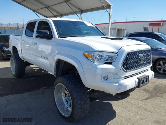 2020 Toyota Tacoma 4WD SR5 with VIN 3TMCZ5AN5LM305778, listed as a IAAI auction lot 42004484 with 27,991 mi miles. Bid and sale history available at carsss.com. Image 1.