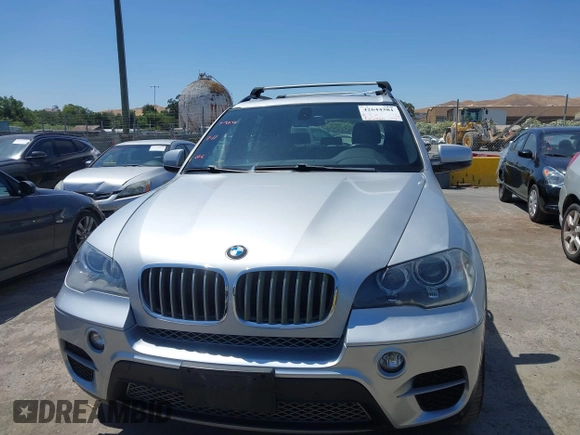 2012 BMW X5 35d with VIN 5UXZW0C58CL671141, listed as a IAAI auction lot 42644381 with 127,464 mi miles and . Bid and sale history available at DreamBid. Image 12.