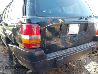 1996 Jeep Grand Cherokee Laredo with VIN 1J4GZ58S3TC197587, listed as a IAAI auction lot 41423318 with 200,116 mi miles. Bid and sale history available at carsss.com. Image 6.