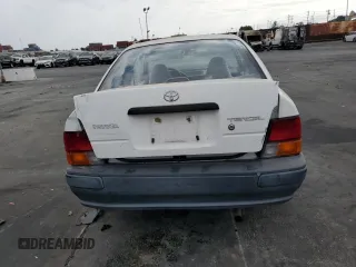 1996 Toyota Tercel DX z VIN JT2AC52L9T0189356, wystawiony jako Copart lot #75311564 z przebiegiem 155 248 mil mil oraz Szkody całkowita. Historia ofert i sprzedaży dostępna na DreamBid. Obrazek 6.