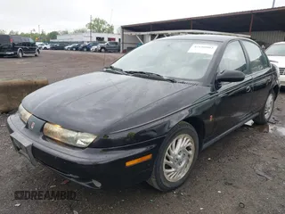 1999 Saturn SL with VIN 1G8ZK5272XZ263163, listed as a IAAI auction lot 42180002 with 138,463 mi miles. Bid and sale history available at carsss.com. Image 2.