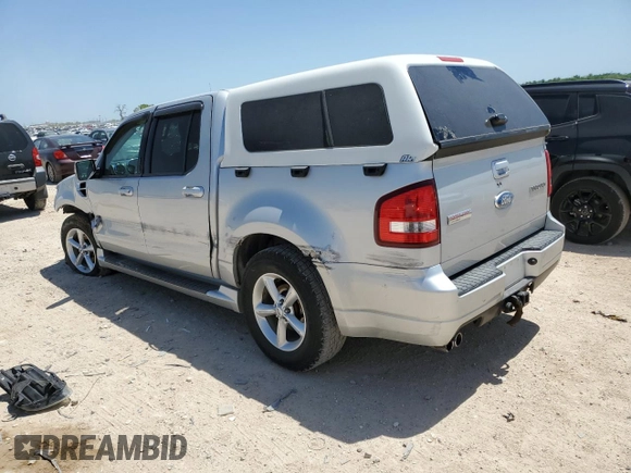 2009 Ford Explorer Sport Trac with VIN 1FMEU23809UA12870, listed as a Copart auction lot 52614055 with 313,938 mi miles and Salvage title. Bid and sale history available at DreamBid. Image 2.