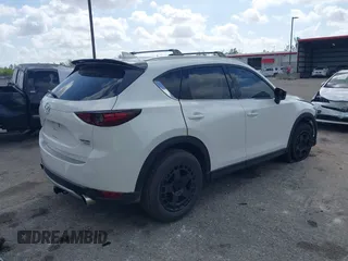 2021 Mazda CX-5 Signature with VIN JM3KFBEY0M0436264, listed as a IAAI auction lot 41568892 with 36,833 mi miles. Bid and sale history available at carsss.com. Image 4.