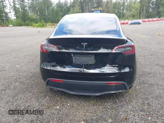 2023 Tesla Model Y Long Range z VIN 7SAYGDEE2PF885116, wystawiony jako IAAI lot #40091902 z przebiegiem 11 779 mil mil oraz . Historia ofert i sprzedaży dostępna na DreamBid. Obrazek 16.
