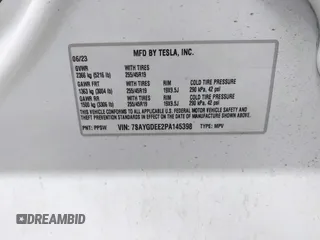 2023 Tesla Model Y Long Range with VIN 7SAYGDEE2PA145398, listed as a IAAI auction lot 41546573 with 20,812 mi miles and . Bid and sale history available at carsss.com. Image 9.