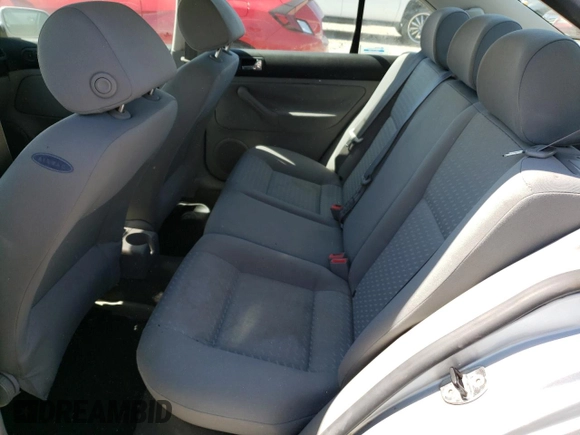 2004 Volkswagen Jetta GL z VIN 3VWRA69M54M007376, wystawiony jako Copart lot #72288984 z przebiegiem 91 687 mil mil oraz Szkoda całkowita • Salvage title. Historia ofert i sprzedaży dostępna na DreamBid. Obrazek 10.