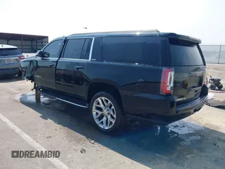2016 GMC Yukon XL SLE with VIN 1GKS1FKC9GR161876, listed as a IAAI auction lot 39948106 with 60,800 mi miles. Bid and sale history available at carsss.com. Image 3.