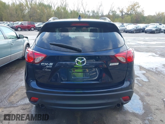 2015 Mazda CX-5 Grand Touring with VIN JM3KE4DY7F0478823, listed as a IAAI auction lot 40731626 with 82,884 mi miles. Bid and sale history available at carsss.com. Image 16.