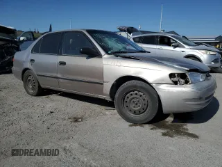 1999 Toyota Corolla VE with VIN 1NXBR12E9XZ158252, listed as a Copart auction lot 58757595 with 232,776 mi miles and Salvage title. Bid and sale history available at DreamBid. Image 4.