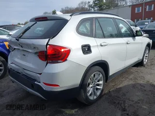 2015 BMW X1 xDrive28i with VIN WBAVL1C59FVY40443, listed as a IAAI auction lot 41777176 with 91,560 mi miles. Bid and sale history available at carsss.com. Image 4.