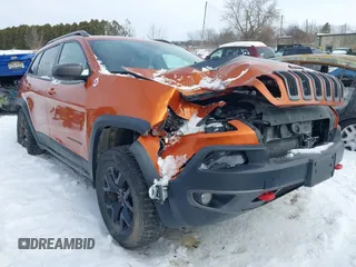 2015 Jeep Cherokee Trailhawk with VIN 1C4PJMBS9FW655233, listed as a IAAI auction lot 41430715 with 138,181 mi miles and . Bid and sale history available at carsss.com. Image 6.