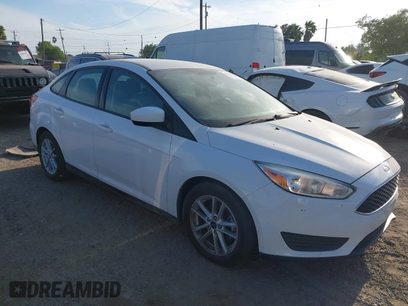 2018 Ford Focus SE z VIN 1FADP3F23JL328462, wystawiony jako IAAI lot #42068209 z przebiegiem 63 194 mil mil oraz . Historia ofert i sprzedaży dostępna na DreamBid. Obrazek 1.
