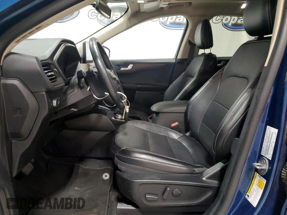 2020 Ford Escape Titanium z VIN 1FMCU9J98LUA93393, wystawiony jako Copart lot #65366925 z przebiegiem 74 750 mil mil oraz Czysty tytuł • Clean title. Historia ofert i sprzedaży dostępna na DreamBid. Obrazek 7.