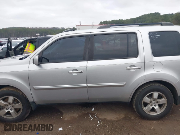 2011 Honda Pilot EX-L with VIN 5FNYF3H6XBB036391, listed as a IAAI auction lot 41100998 with 120,516 mi miles and . Bid and sale history available at DreamBid. Image 14.