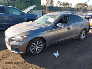 2015 Infiniti Q50 Premium z VIN JN1BV7AR2FM423666, wystawiony jako IAAI lot #41345228 z przebiegiem 67 027 mil mil oraz . Historia ofert i sprzedaży dostępna na DreamBid. Obrazek 17.