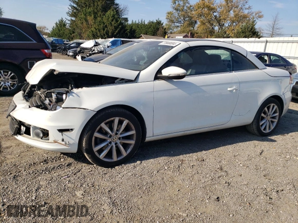 2015 Volkswagen Eos Komfort with VIN WVWBW8AH1FV000692, listed as a Copart auction lot 77866694 with 114,156 mi miles and Salvage Title. Bid and sale history available at DreamBid. Image 1.