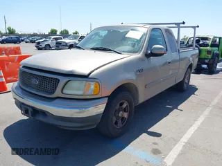 2002 Ford F-150 XL with VIN 1FTRX17272KE07014, listed as a IAAI auction lot 42381725 with 212,294 mi miles and . Bid and sale history available at DreamBid. Image 2.