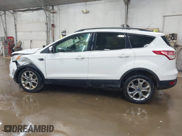 2014 Ford Escape SE with VIN 1FMCU9G99EUC15477, listed as a IAAI auction lot 42147162 with 98,886 mi miles and . Bid and sale history available at DreamBid. Image 14.