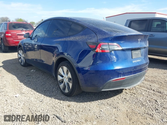 2021 Tesla Model Y Standard Range z VIN 5YJYGDED6MF107711, wystawiony jako IAAI lot #41794384 z przebiegiem 86 934 mil mil oraz . Historia ofert i sprzedaży dostępna na DreamBid. Obrazek 3.
