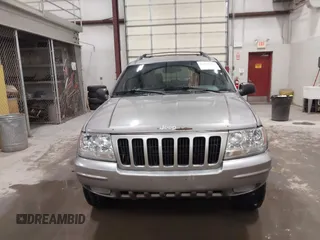 1999 Jeep Grand Cherokee Limited with VIN 1J4GW68N7XC752314, listed as a IAAI auction lot 41776905 with 228,023 mi miles. Bid and sale history available at carsss.com. Image 13.