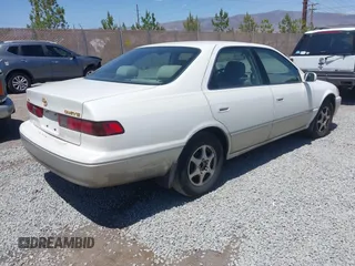 1999 Toyota Camry LE z VIN JT2BG22K3X0342513, wystawiony jako IAAI lot #42371033 z przebiegiem 159 894 mil mil oraz . Historia ofert i sprzedaży dostępna na DreamBid. Obrazek 4.