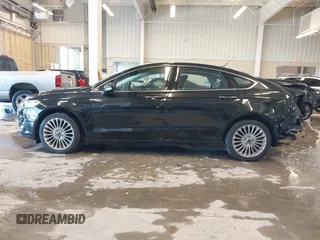2014 Ford Fusion Titanium with VIN 3FA6P0K93ER115805, listed as a IAAI auction lot 41009602 with 136,021 mi miles. Bid and sale history available at carsss.com. Image 15.