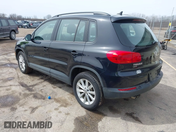 2018 Volkswagen Tiguan with VIN WVGBV7AX3JK002325, listed as a IAAI auction lot 41960059 with 57,619 mi miles and . Bid and sale history available at DreamBid. Image 3.