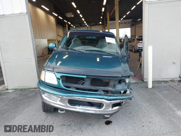 1997 Ford F-150 XL with VIN 1FTEX18L1VKB44867, listed as a IAAI auction lot 41266572 with 105,061 mi miles. Bid and sale history available at carsss.com. Image 12.