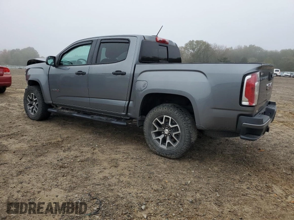 2021 GMC Canyon 4WD AT4 w/Cloth with VIN 1GTG6FEN8M1115918, listed as a Copart auction lot 80592964 with 59,888 mi miles and Salvage Title. Bid and sale history available at carsss.com. Image 2.